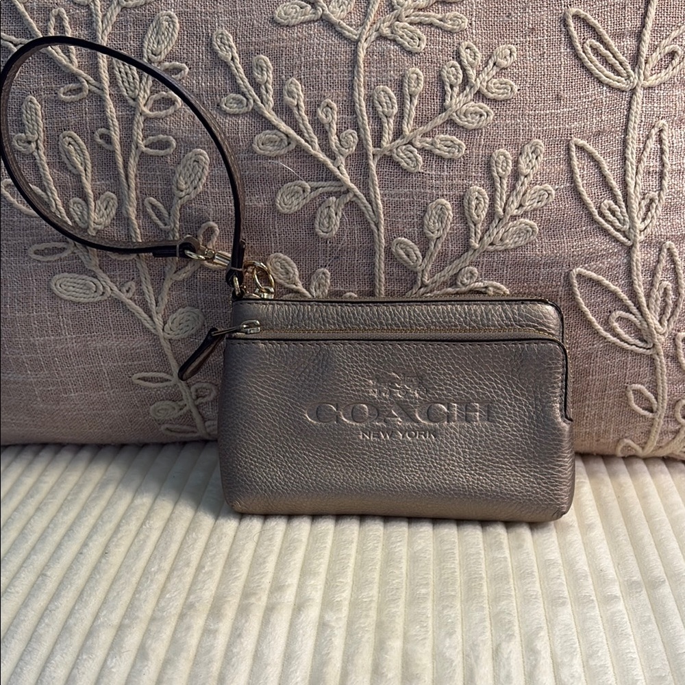 Coach Silver Clutch with Embossed Design